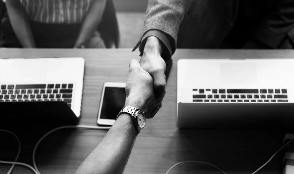 business people shaking hands agreement